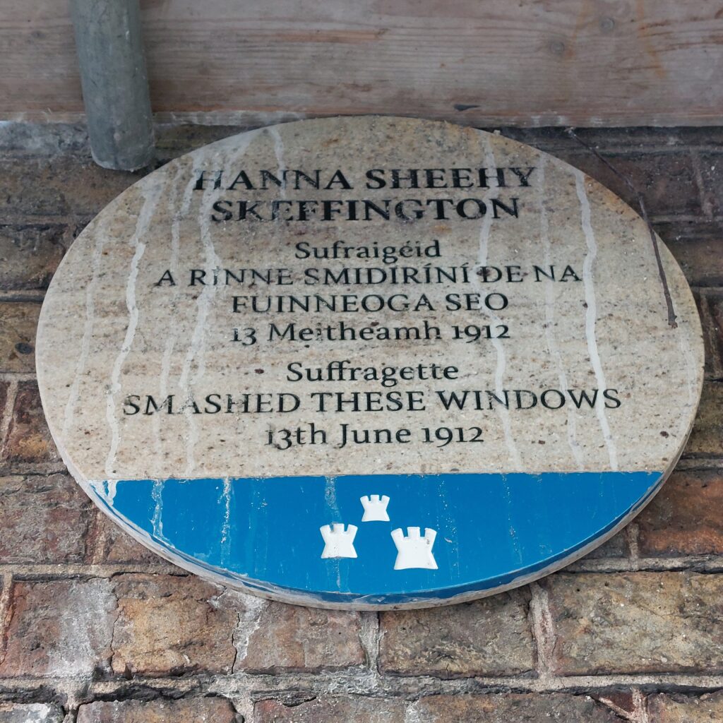 Blue plaque commemorating where suffragette Hanna Sheehy Skeffington smashed windows at Dublin Castle in 1912