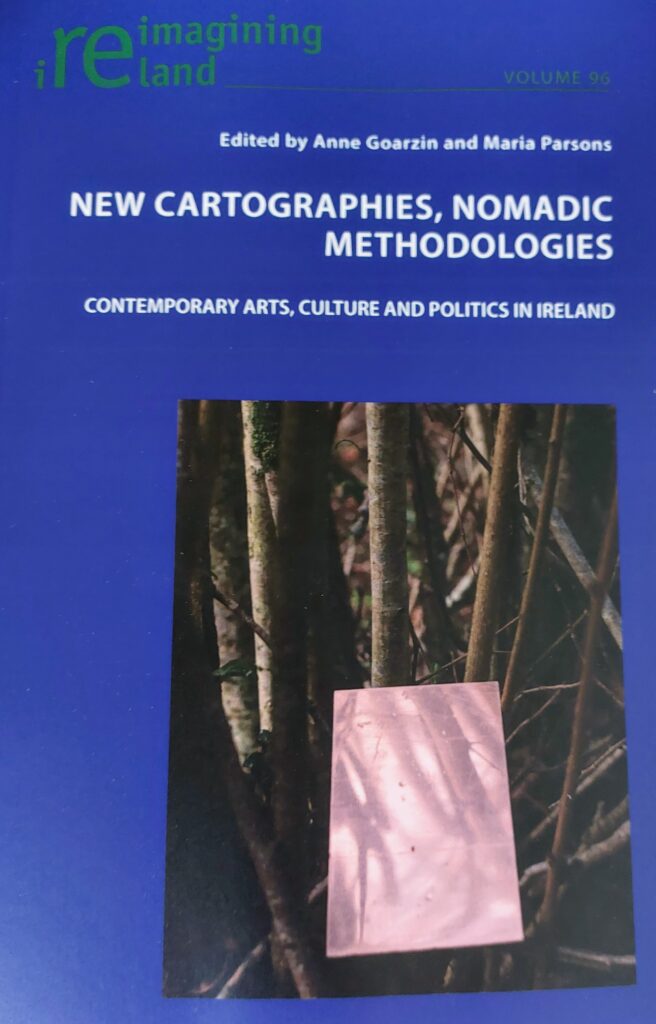 Book cover of New Cartographies, Nomadic Methodologies edited by Anne Goarzin and Maria Parsons. Blue background with a photograph of a page among branches of a tree.