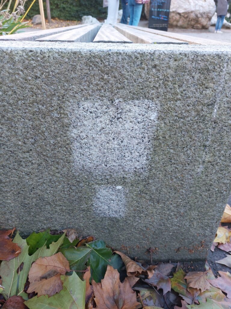 Space on the side of a stone bench in Merrion Square park where a Sheela na Gig commemorating Lady Jane Wilde used to be