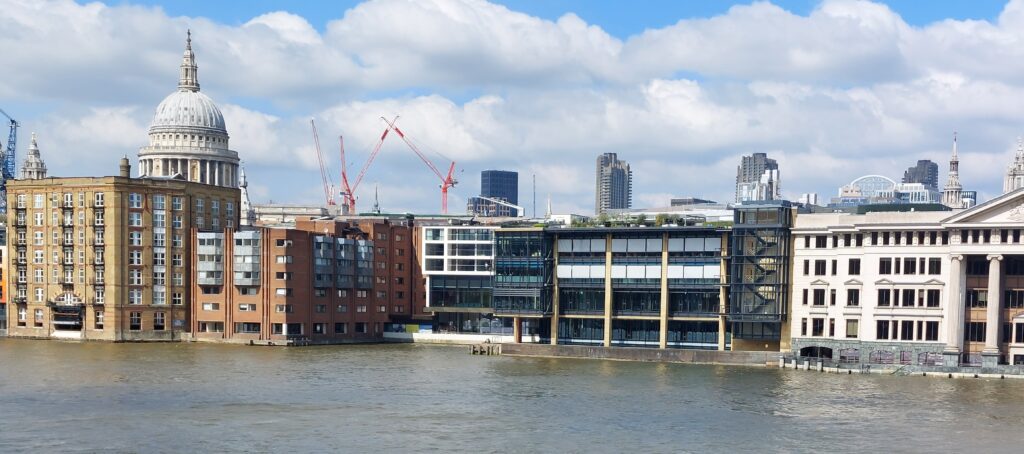 View of London from Southwark bridge, showing the Thames lapping the buildings