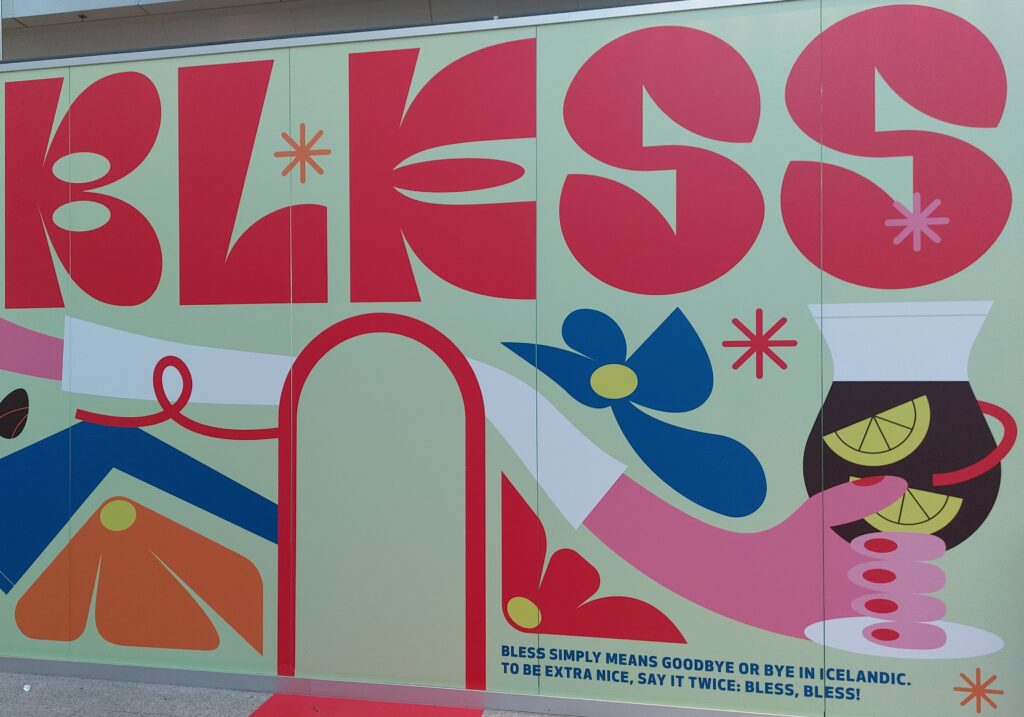 Floral mural with the word Bless, Icelandic for Bye, at Reykjavik Airport
