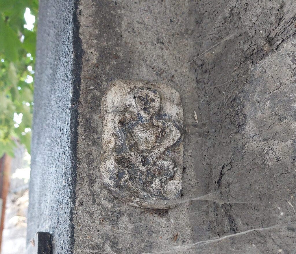 a small figure of a Sheela na Gig on a wall outside Grangegorman, placed there as part of a feminist art project