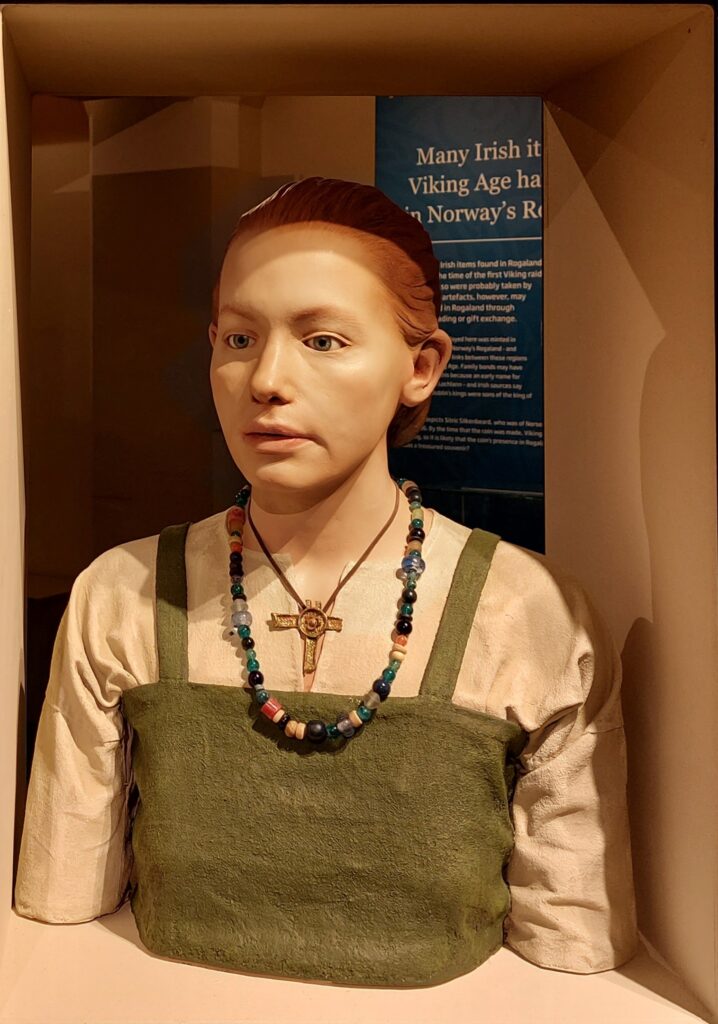 Reproduction of what a Viking princess would look like - red hair, wearing beads and linen clothing