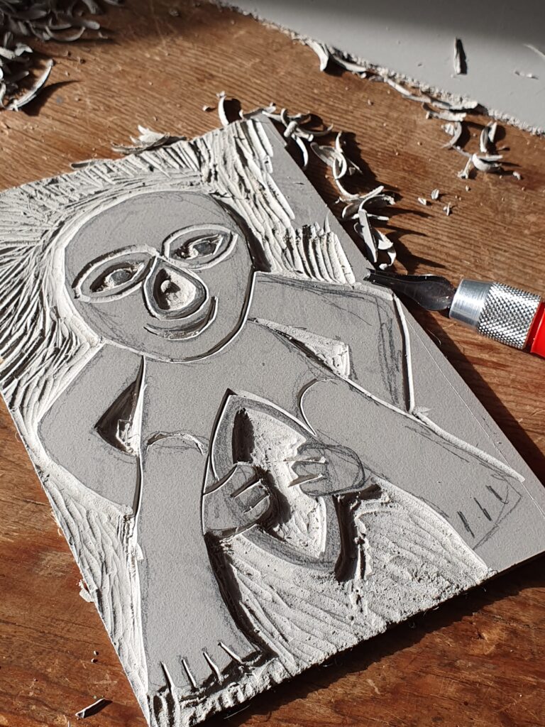 Lino print of a Sheela na Gig.